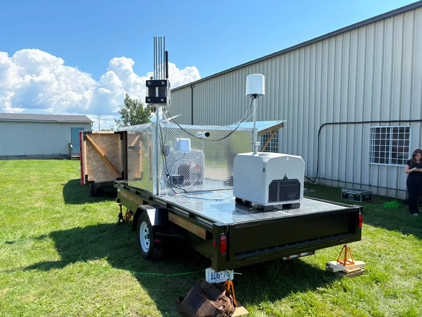 A mobile detection trailer carrying RF, optical, and acoustic sensors, deployed in the field